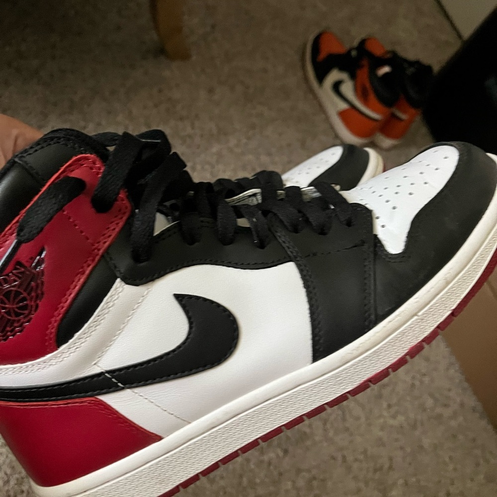 Air Jordan 1 black toe.